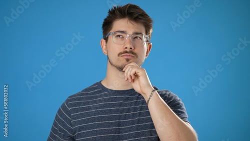 Принти на полотні Portrait of thinking, smart puzzled pensive young hipster man 20s looks around t