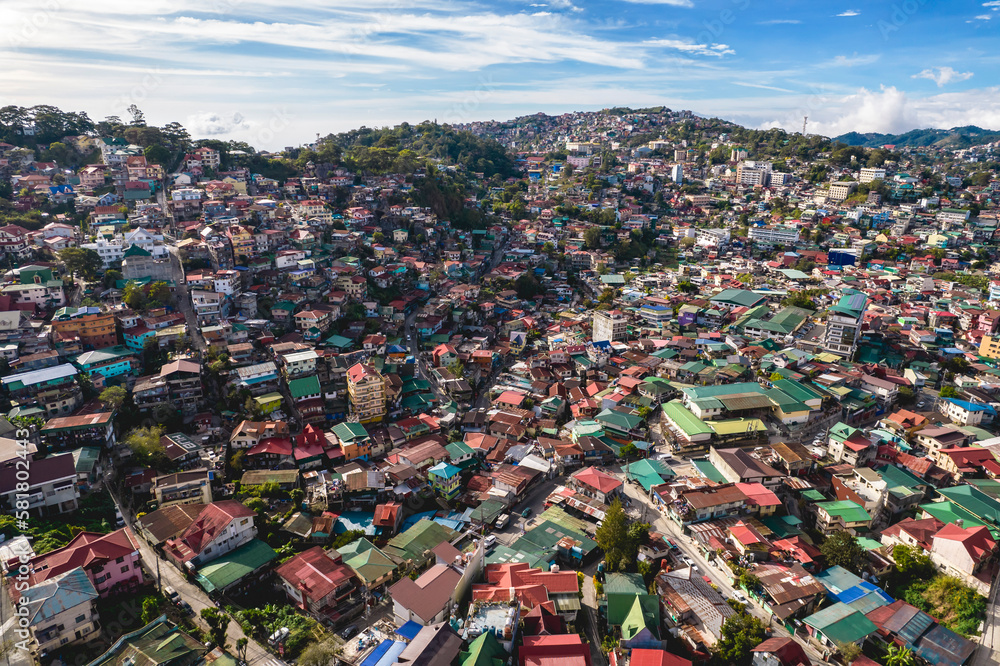 Baguio City, Philippines - Afternoon aerial of the skyline of the city extending up to the hills.