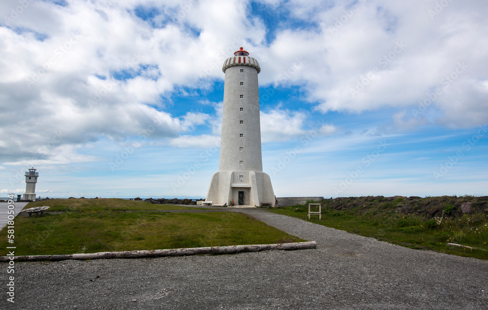 Beautiful lighthouse, beacon in Iceland near sea, during amazing sunny weather, travel photo tip, traveling around the world, Akranes