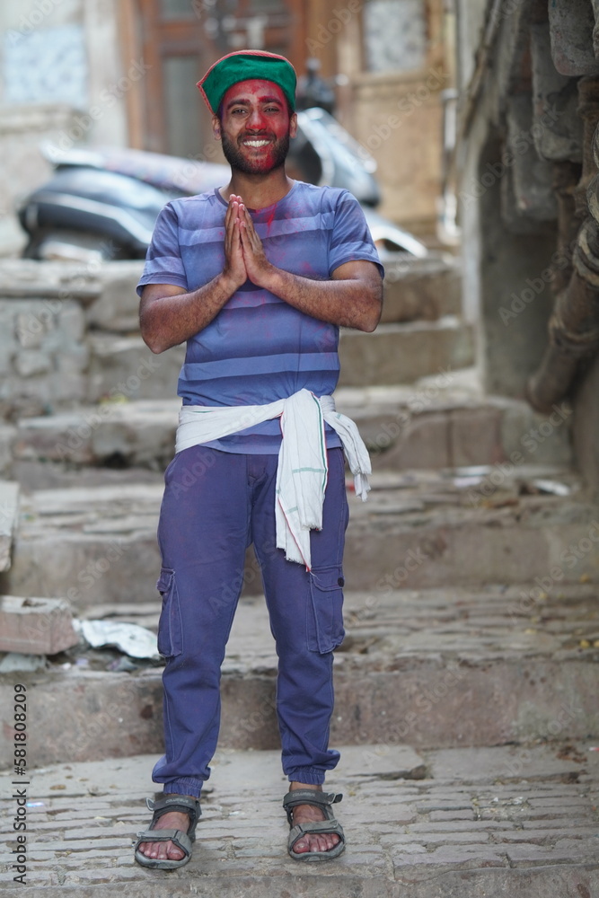 a indian boy wearing Wool Himachal Cap green. boy playing holi image HD