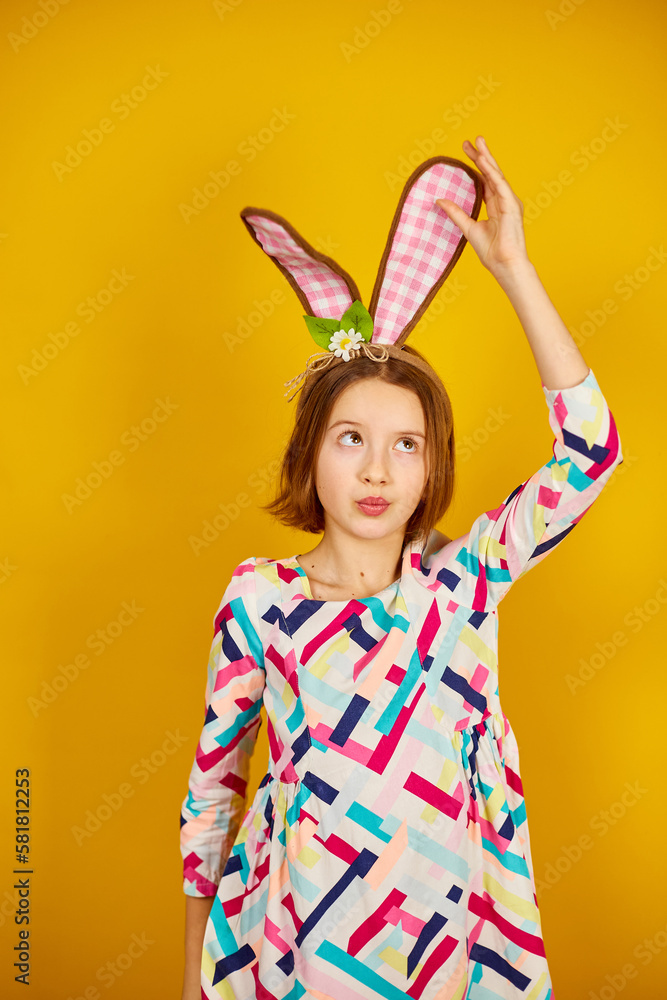 Happy playful teenager girl wearing bunny ears Happy playful teenager girl wearing bunny ears