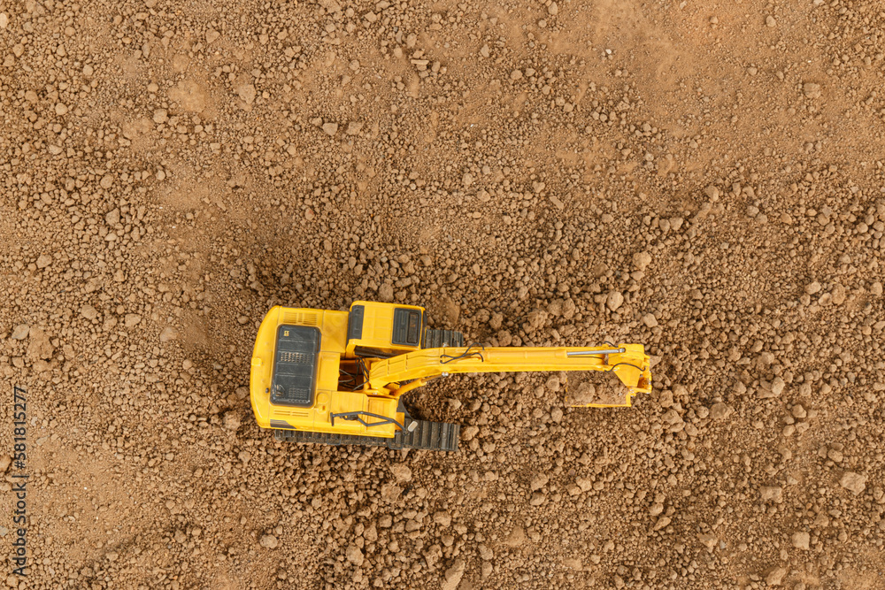Crawler excavators are digging soil with in the construction site ,Top view Crawler excavators are digging soil with in the construction site ,Top view