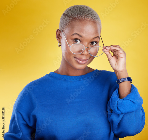 Face, black woman and glasses for vision, fashion and casual outfit against a studio background. Portrait, African American female and lady with spectacles, eyewear and clear sight with confidence