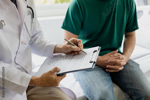 male health checkup with doctor Doctors consult about diagnosis of male diseases or mental illnesses in medical clinics or mental health facilities in hospitals.