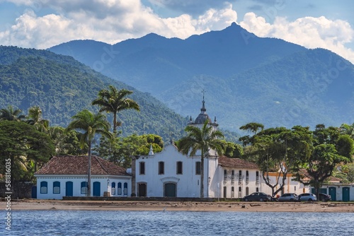 Paraty, Brazil. Our Lady of Sorrows church seen from the sea. Historic downtown. Colonial city founded in 1667. National Historic Heritage. In the background, the mountains of Serra da Bocaina. © Stefan Lambauer