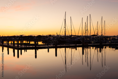 Sailboats docked in the Matanzas River seen in silhouette at sunrise, St. Augustine, Florida, USA