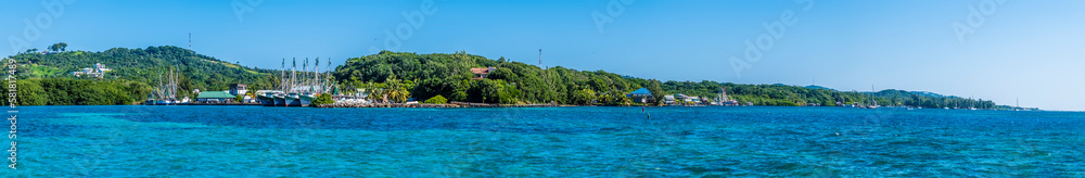A panorama view across a fishing village on Roatan Island on a sunny day