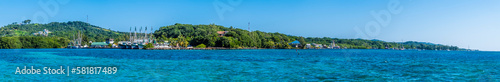 A panorama view across a fishing village on Roatan Island on a sunny day