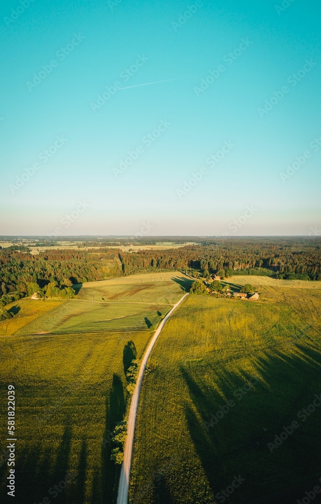 Aerial view over the countryside at warm sunrise