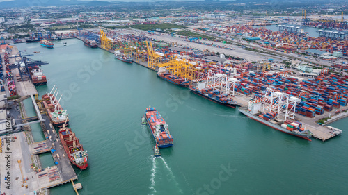 cargo container ship transit in commercial dock, distribution centers import export international, global business and industry transportation, aerial view © SHUTTER DIN