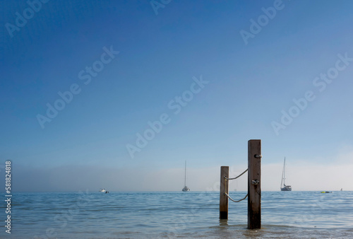 view of the Poetto beach with two poles and ropes in Cagliari © Alessandro