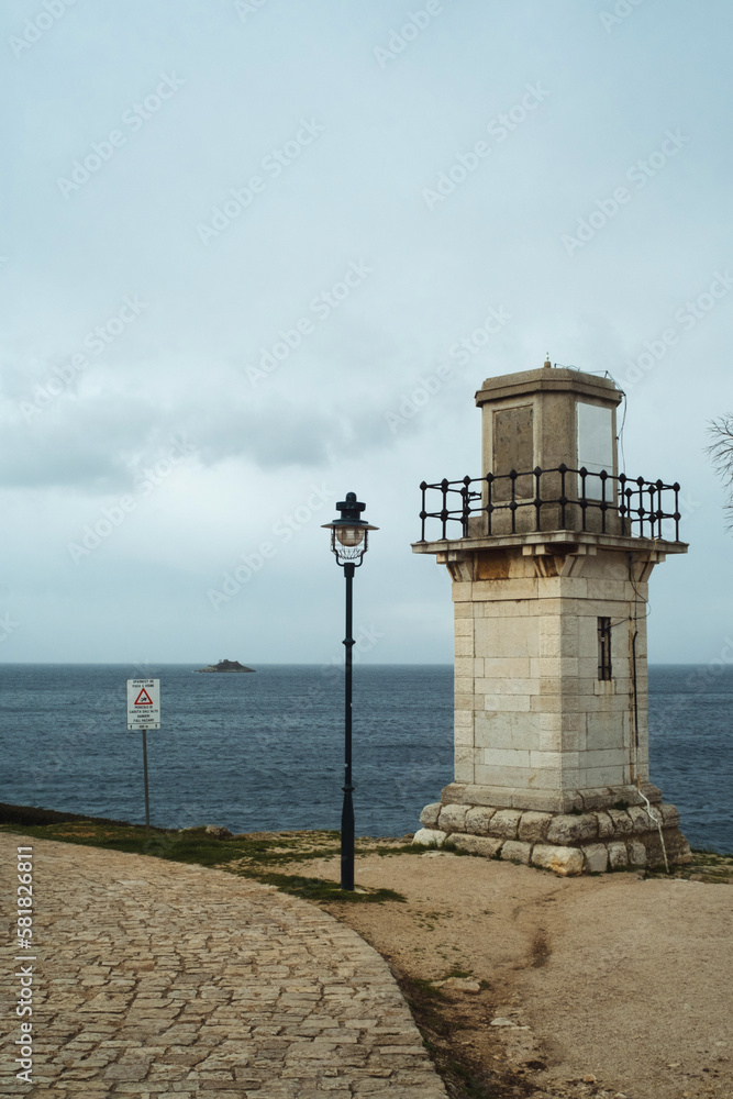 Old lighthouse in the Adriatic sea harbour of historic Rovinj Istria Croatia