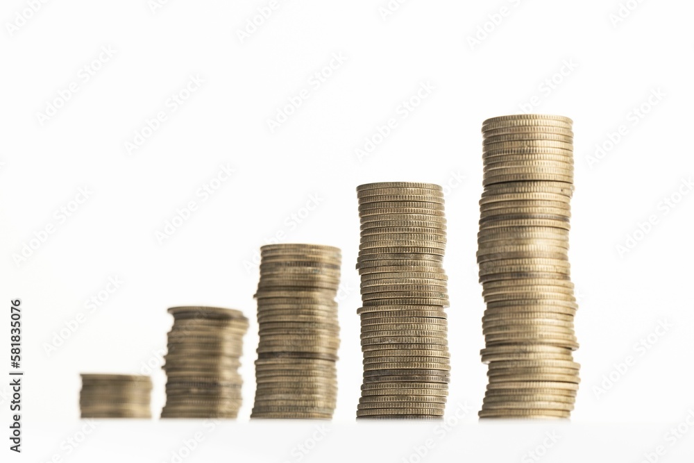 Rising stack of coins isolated on a white background Rising stack of coins isolated on a white background
