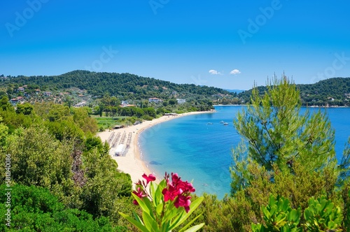 tourists enjoy the sun and the sea on a Greek beach, Skiathos, Greece