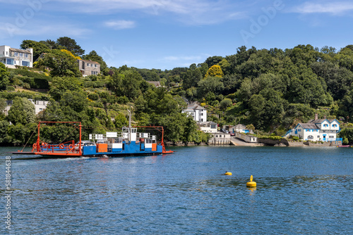 View from Fowey of the Bodinnick Ferry about to arrive in Bodinnick. On the right is Ferryside, once the home of famous author Daphne du Maurier. photo