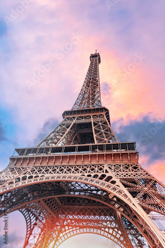 The Eiffel Tower in Paris against the backdrop of a beautiful evening sky.