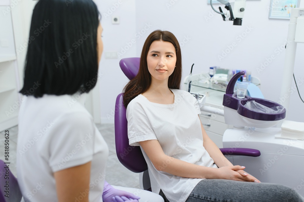 Dentist and patient in dentist office Dentist and patient in dentist office