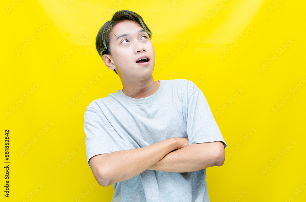 estactic attractive funky young asian man shocked happily opening mouth and raising his hand. asian man in gray tshirt feels shock with wow surprised expression.
estactic attractive funky young asian man shocked happily opening mouth and raising his hand. asian man in gray tshirt feels shock with wow surprised expression.