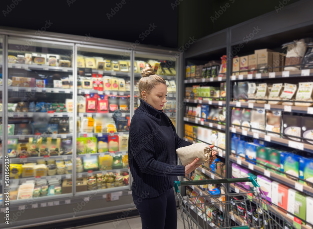 supermarket shopping,Woman choosing a dairy products at supermarket.