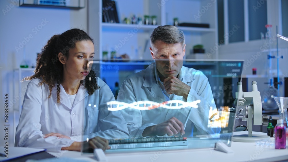 Obraz premium Genetic lab workers puzzled with experiment results, looking at screen, DNA research