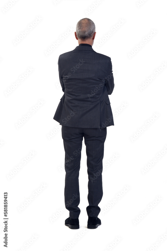back view of a man standing with suit and arms crossed on white background back view of a man standing with suit and arms crossed on white background
