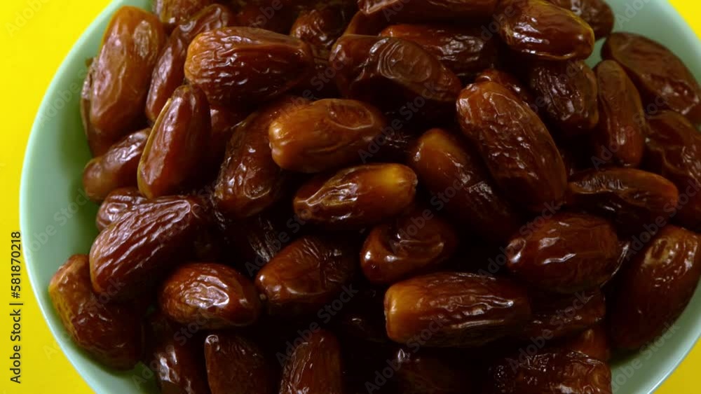 Dates. Dried date palm fruits. Healthy sweet snack food bowl. Pile of tasty dry dattes in plate. Date harvest symbolizing Ramadan. Dates. Dried date palm fruits. Healthy sweet snack food bowl. Pile of tasty dry dattes in plate. Date harvest symbolizing Ramadan.