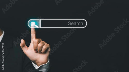 Business people searching for information are clicking information to Internet search pages like a touch screen computer. Concept of education, knowledge, analysis, internet to connect wirelessly.