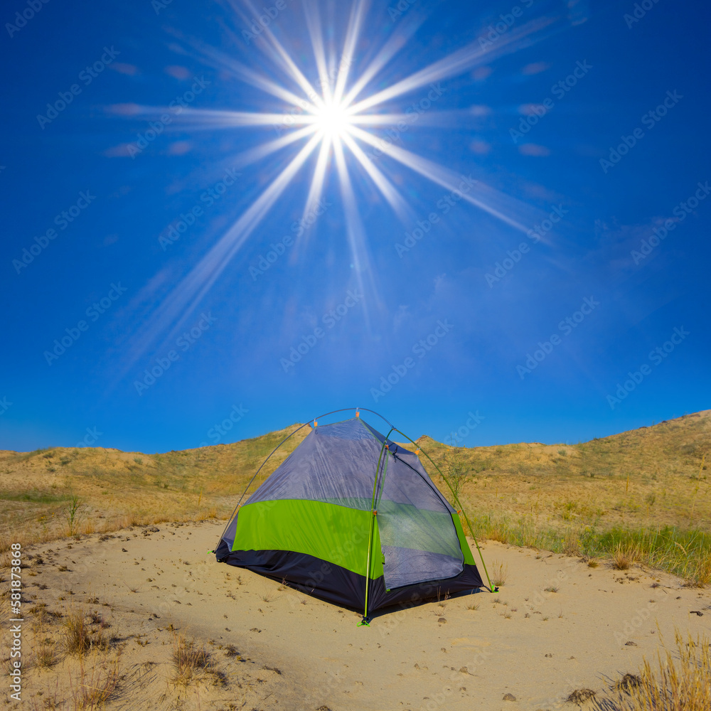 small touristic tent stay among sandy desert at sunny day