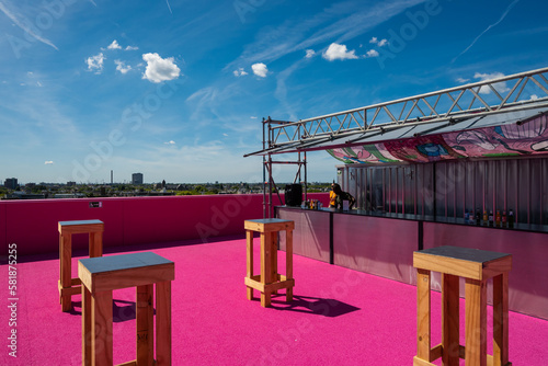 Dutch rooftop terrace Het Nieuwe Instituut, the Museum of Architecture Rotterdam Netherlands, Design and Digital Culture with pink carpet city skyline view for public sunny summer day