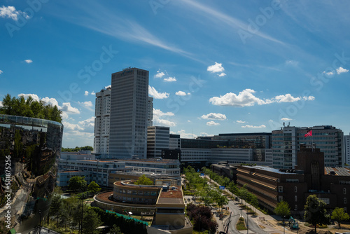 MVRDV rooftop terrace on iconic modern architecture mirror glass building in Dutch Museumpark Rotterdam Netherlands on sunny summer day. Also Erasmus MC hospital medical facility buildings photo