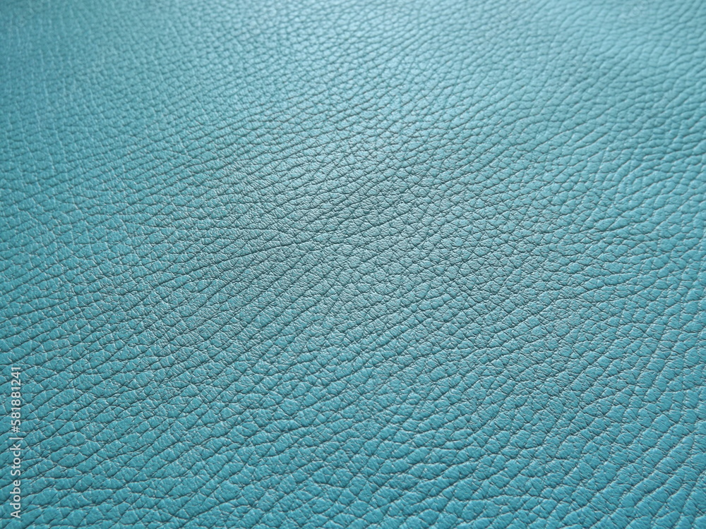Genuine leather and genuine suede turquoise blue close-up as background Genuine leather and genuine suede turquoise blue close-up as background