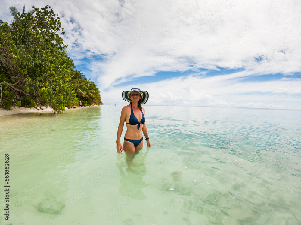 beautiful woman relaxing on a tropical beach beautiful woman relaxing on a tropical beach