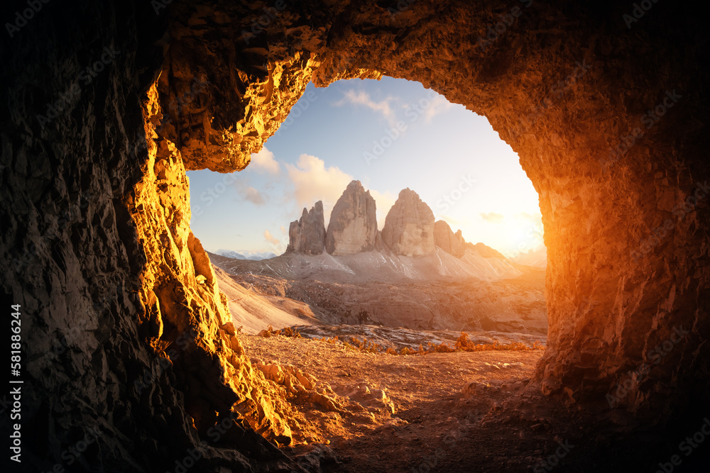 View from the cave in mountain against Three peaks of Lavaredo during sunset. Dolomite Alps, Italy. Landscape photography - obrazy, fototapety, plakaty 