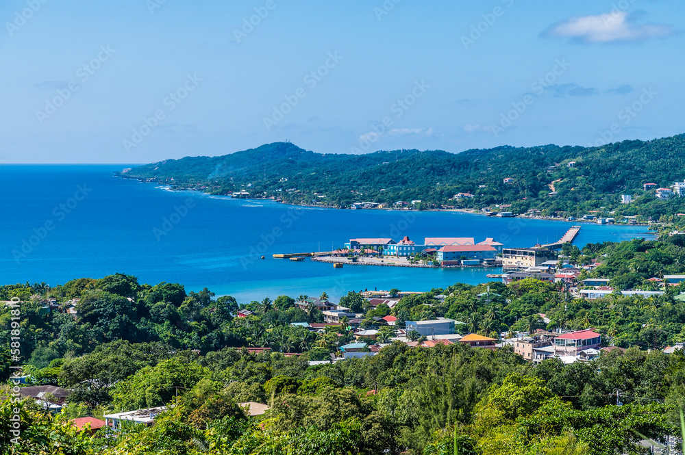 A view looking down over the port of Roatan on Roatan Island on a sunny day