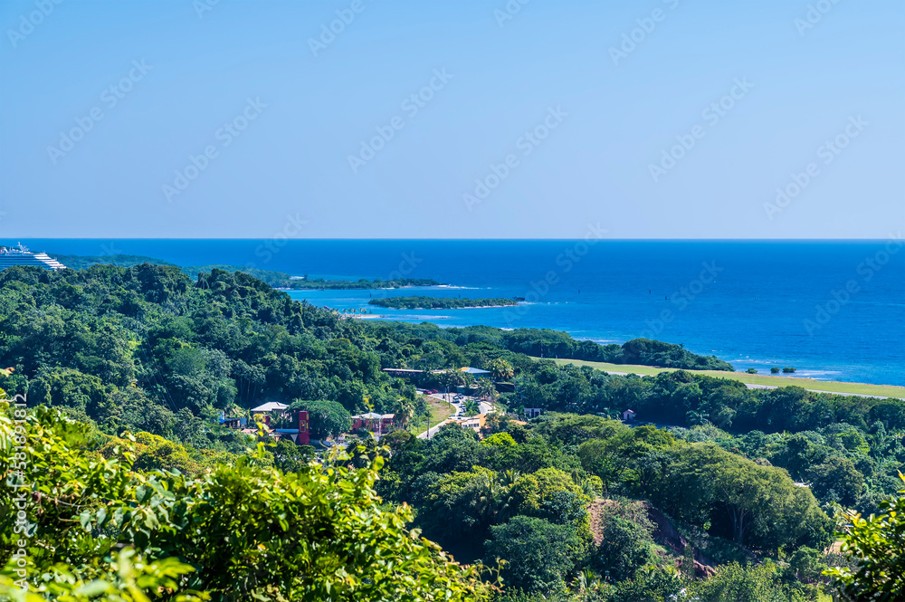 A view looking down over the airport of Roatan on Roatan Island on a sunny day