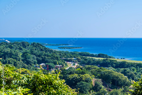 A view looking down over the airport of Roatan on Roatan Island on a sunny day