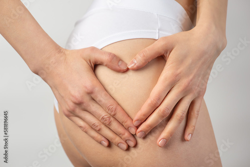 Wallpaper Mural young slender woman in white lingerie on a gray background Torontodigital.ca