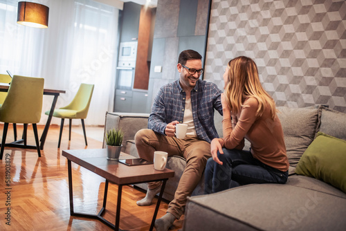 Happy man and woman enjoying at home