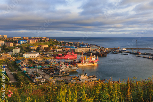 Sakhalin city of Korsakov at sunset! Port and Sea of ​​Japan in Aniva Bay! Red ships and picturesque sea. photo