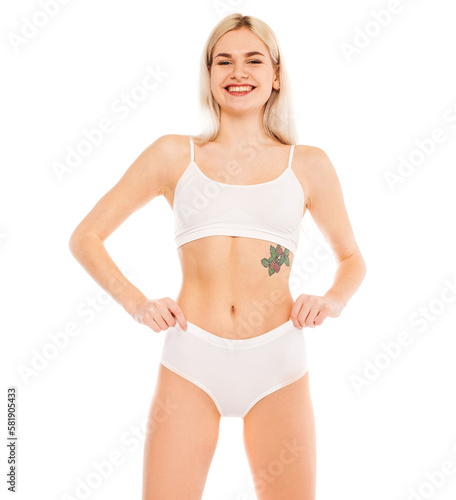 Young beautiful blonde woman in white sports underwear © Andrey_Arkusha