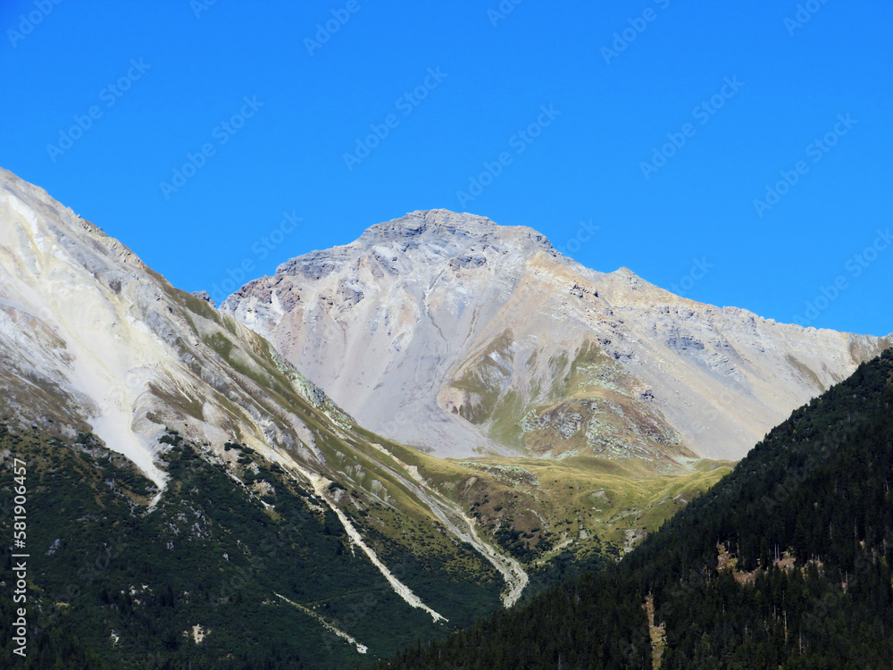 High swiss alpine peak Lenzerhorn (2906 m) above the tourist-agricultural village Alvaneu Bad (Alvagni Bogn) and river Albula or Alvra - Canton of Grisons, Switzerland (Kanton Graubünden, Schweiz)