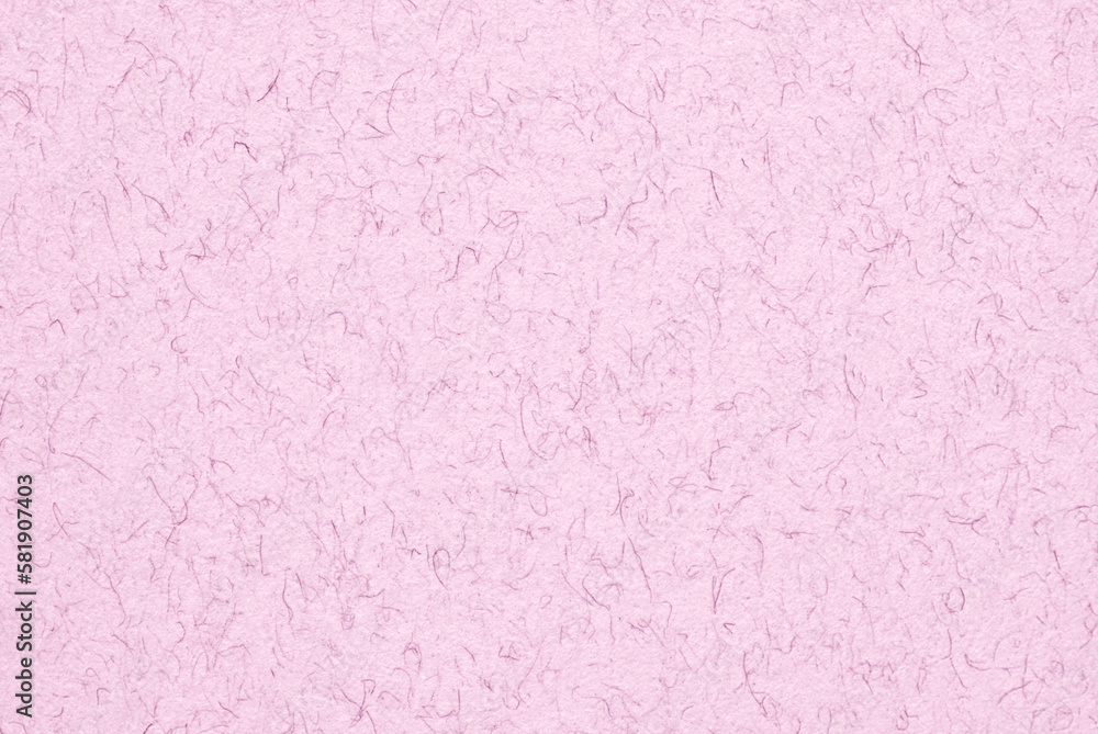 A sheet of light pink fibrous craft paper texture as background A sheet of light pink fibrous craft paper texture as background