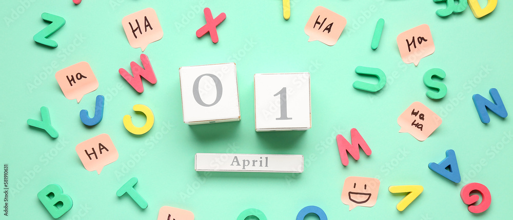 Calendar with date of April Fool's Day and colorful letters on mint background Calendar with date of April Fool's Day and colorful letters on mint background