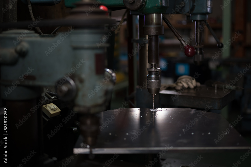 Part machining with drilling machine