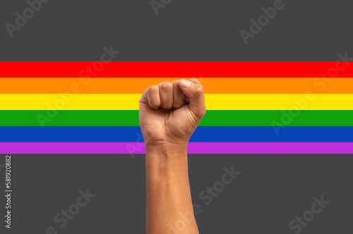 fist up clenched hand with lgbt flag