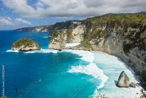Diamond beach in Nusa Penida Island, Indonesia, surrouded by huge cliffs