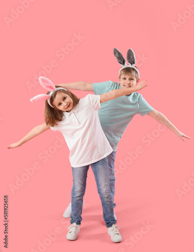 Little children in bunny ea...
