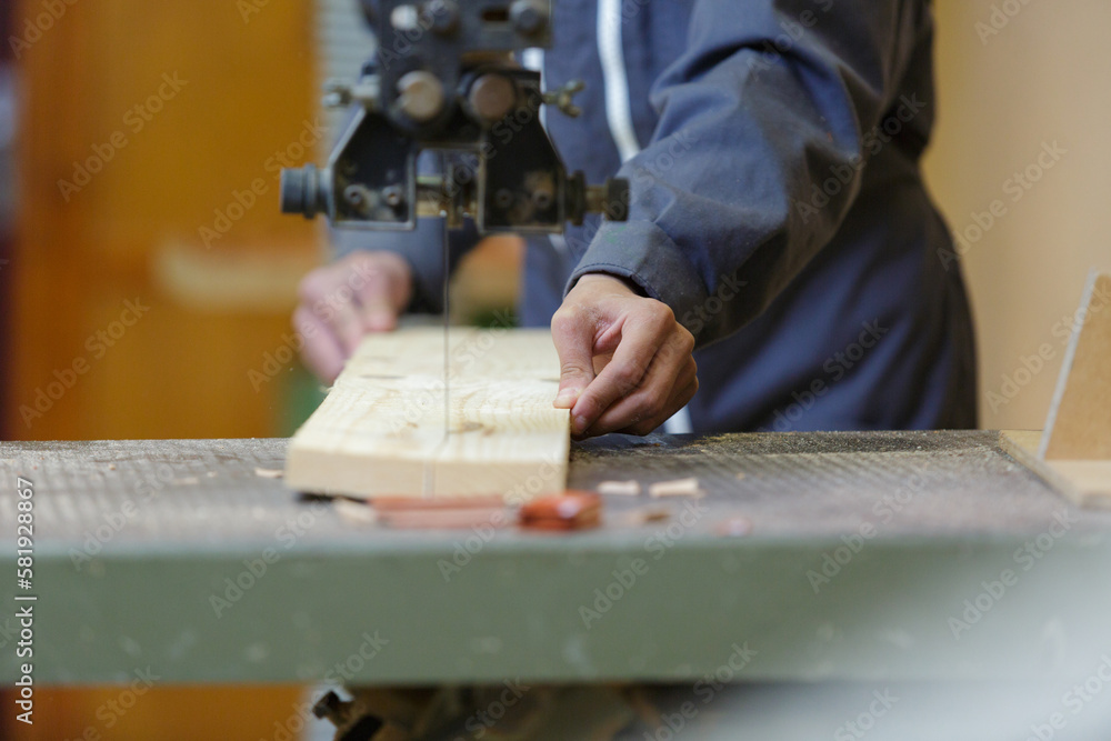 close up of hands cutting wood close up of hands cutting wood