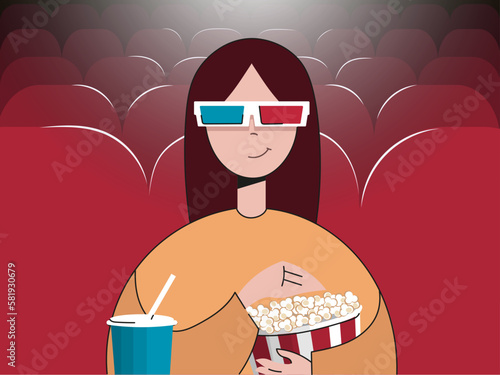 girl in the cinema with popcorn watching a movie