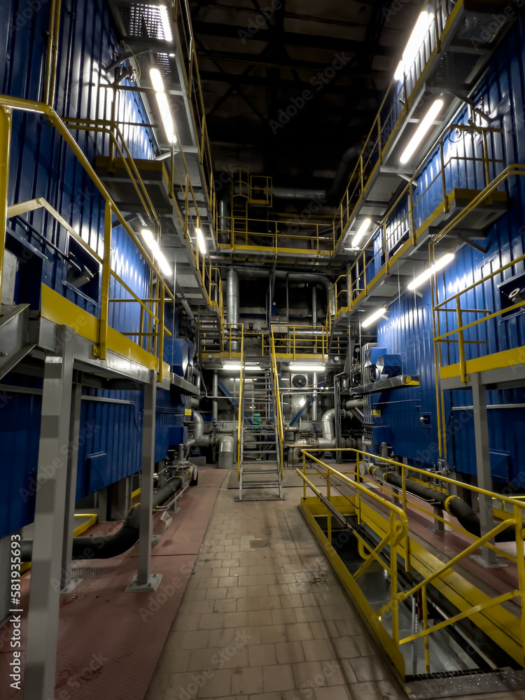 Side walls of two water district heating boilers fired with natural gas after modernization. Fittings at the boilers. Side walls of two water district heating boilers fired with natural gas after modernization. Fittings at the boilers.